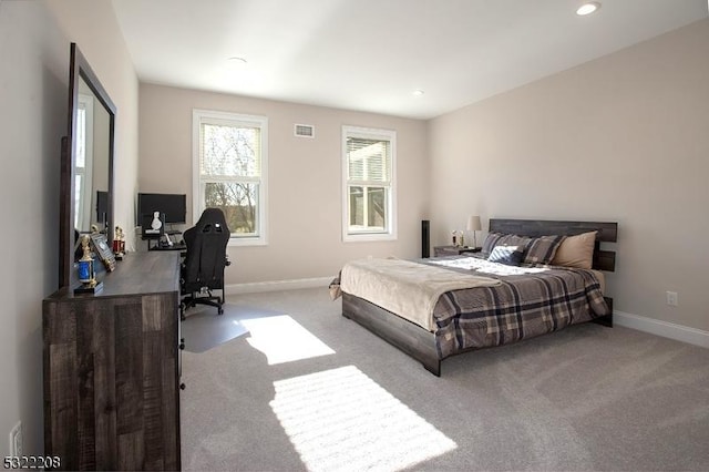 carpeted bedroom featuring baseboards, visible vents, and recessed lighting