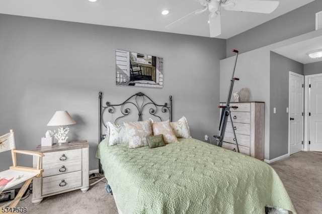 carpeted bedroom featuring a ceiling fan and baseboards