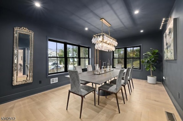 dining space with a wealth of natural light, visible vents, and baseboards