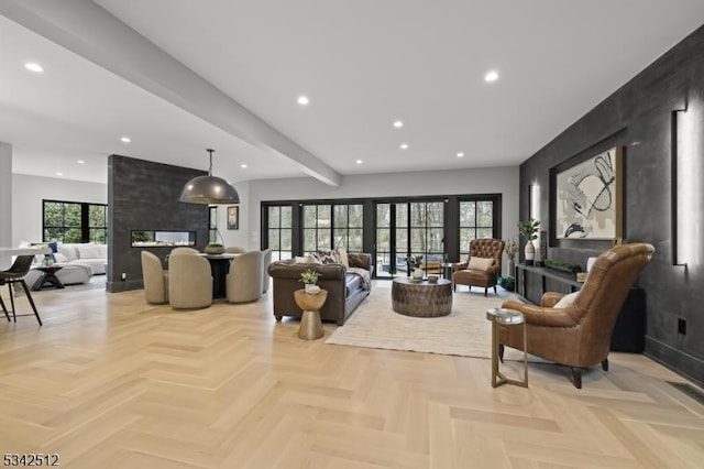 living area featuring recessed lighting, a fireplace, and beamed ceiling