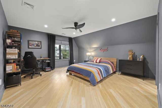 bedroom featuring lofted ceiling, recessed lighting, wood finished floors, visible vents, and a ceiling fan