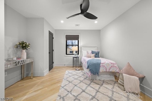 bedroom featuring recessed lighting, wood finished floors, visible vents, and baseboards