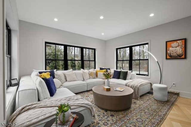 living room with baseboards and recessed lighting