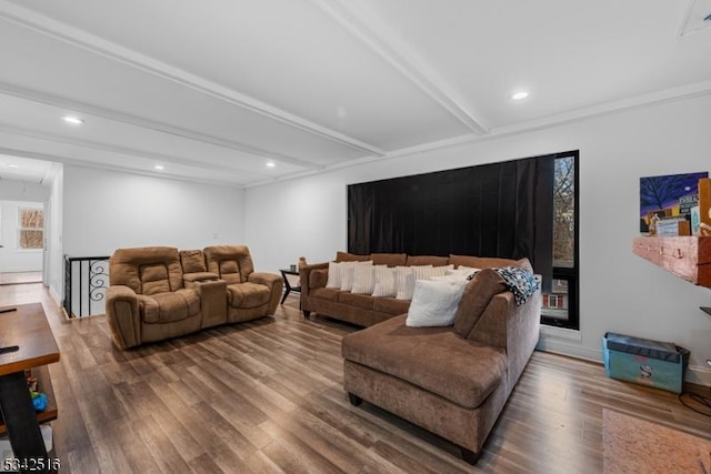 living area featuring beamed ceiling, recessed lighting, attic access, and wood finished floors