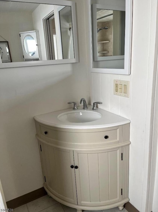 bathroom with tile patterned flooring and vanity