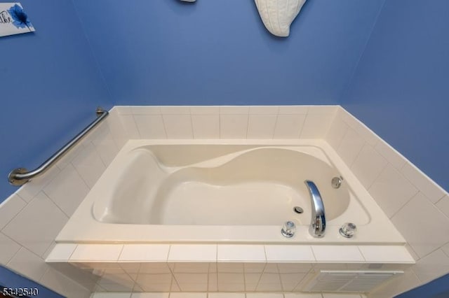 bathroom with a garden tub