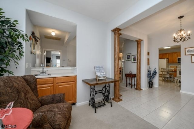 bathroom with visible vents, tile patterned flooring, baseboards, vanity, and ornate columns