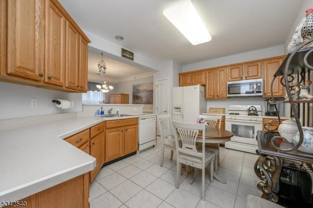 kitchen with a notable chandelier, a sink, white appliances, a peninsula, and light tile patterned floors