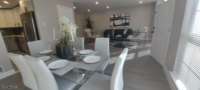 dining room with recessed lighting