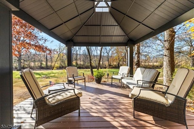 deck featuring a gazebo and a lawn