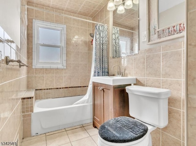 full bath featuring tile patterned flooring, toilet, vanity, tile walls, and shower / bath combination with curtain