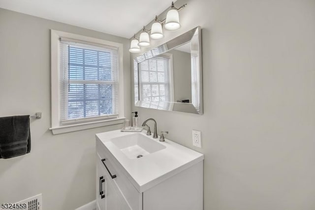 bathroom featuring visible vents and vanity