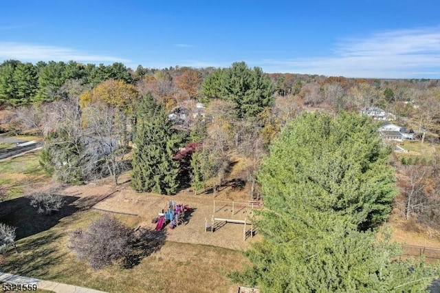 birds eye view of property with a wooded view