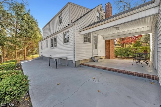 rear view of house with entry steps