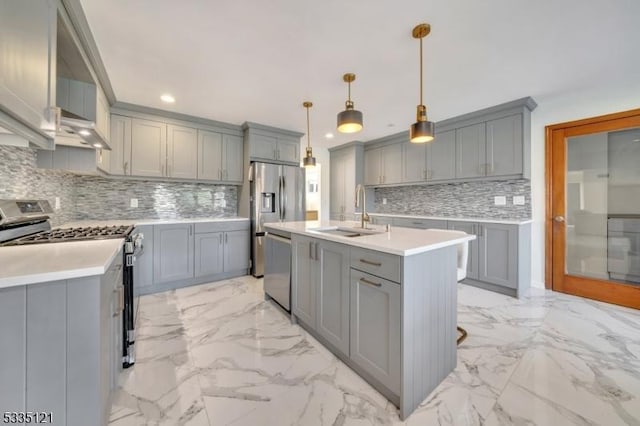 kitchen featuring stainless steel appliances, gray cabinets, and a sink