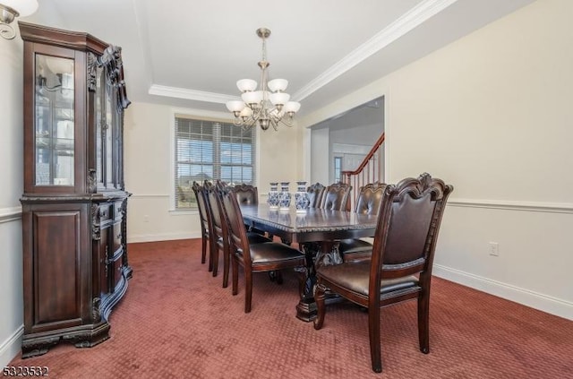 dining area featuring baseboards, crown molding, dark carpet, and a notable chandelier