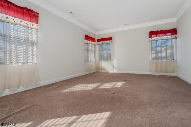 empty room with carpet, baseboards, and ornamental molding