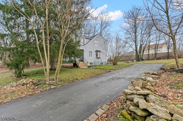 view of road with aphalt driveway