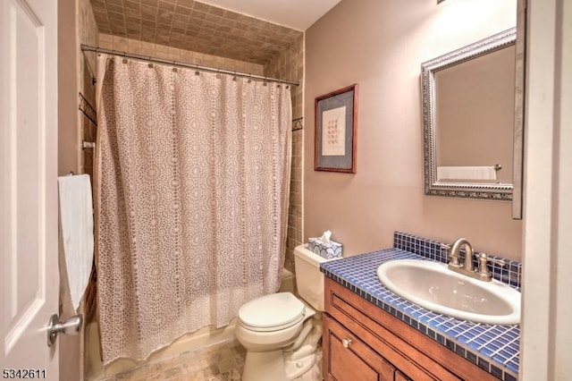 bathroom with vanity, toilet, and shower / tub combo with curtain