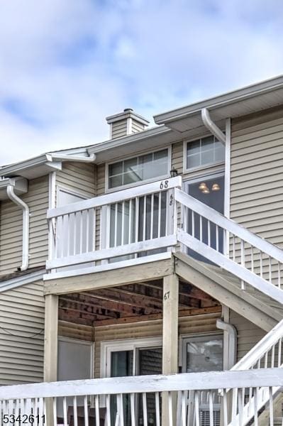 view of side of property featuring a balcony