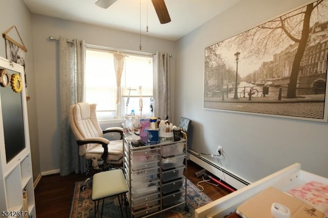 home office featuring a ceiling fan, baseboards, baseboard heating, and wood finished floors