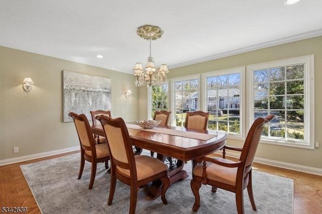 dining area with recessed lighting, baseboards, an inviting chandelier, and ornamental molding