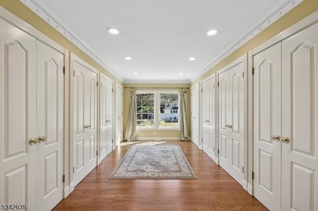 interior space with recessed lighting, crown molding, and wood finished floors