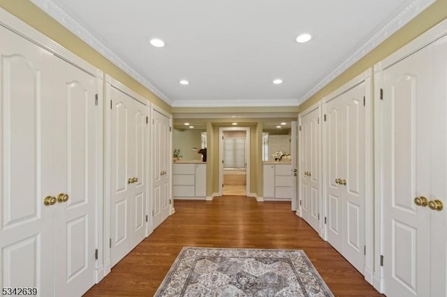 hallway with recessed lighting, dark wood-style floors, and crown molding