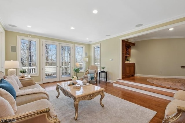 living room featuring ornamental molding, wood finished floors, recessed lighting, french doors, and baseboards