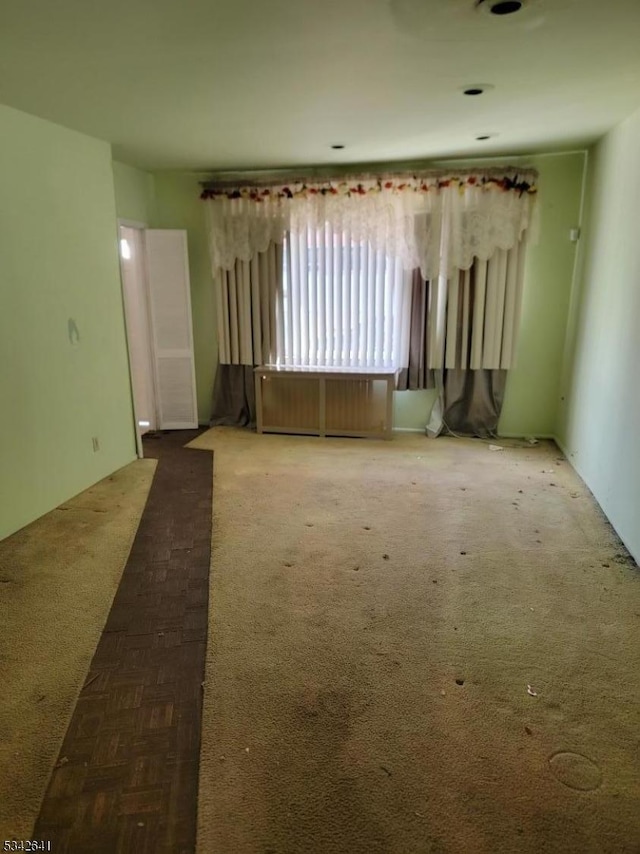 empty room featuring carpet floors