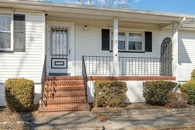 doorway to property featuring a porch