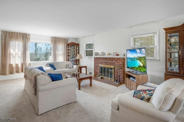 living area featuring carpet and a fireplace