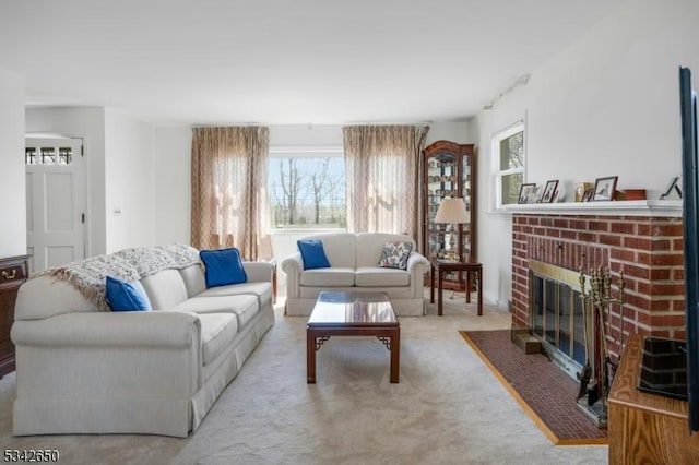 carpeted living area with a fireplace