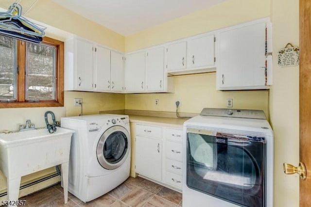 laundry area with washing machine and dryer and cabinet space