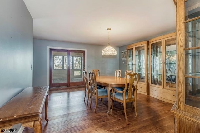 dining space with dark wood finished floors