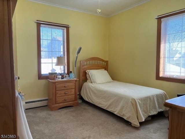 bedroom with a baseboard radiator, multiple windows, crown molding, and light carpet