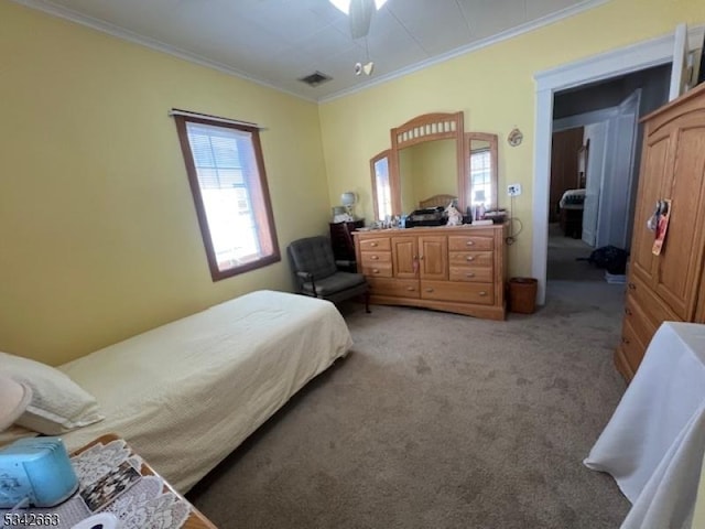 bedroom featuring light carpet, a ceiling fan, visible vents, and crown molding