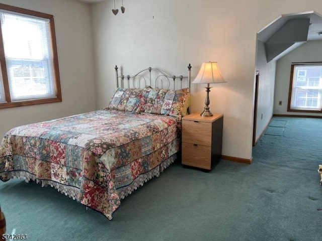 bedroom with multiple windows, carpet, and baseboards