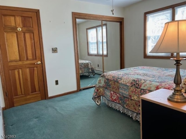 carpeted bedroom featuring baseboards and baseboard heating