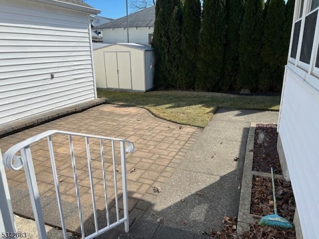 view of patio featuring an outbuilding and a shed