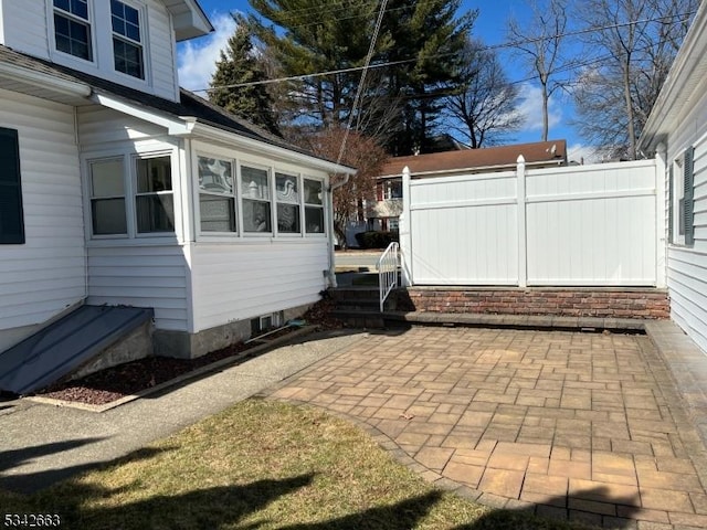 view of home's exterior with a patio