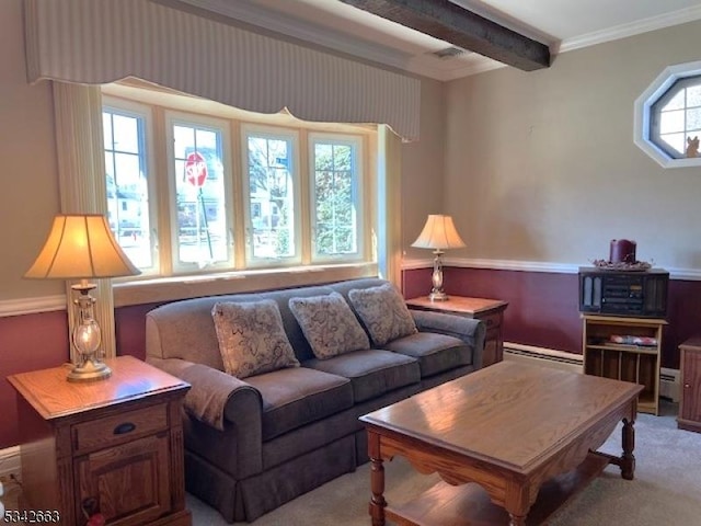 carpeted living area with ornamental molding, baseboard heating, and beam ceiling