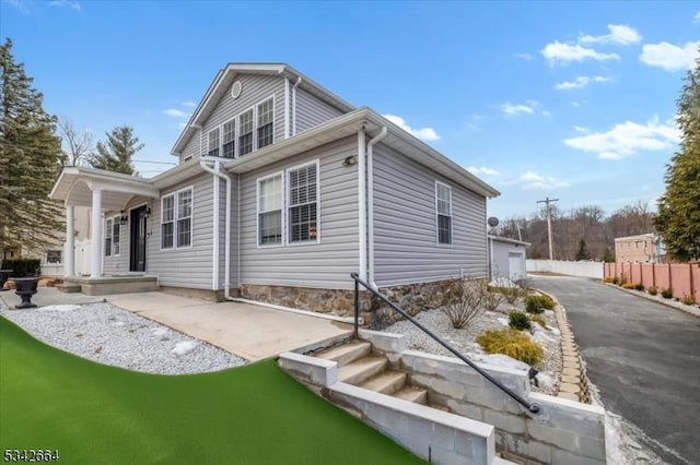 view of home's exterior with fence