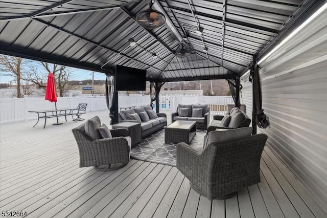 wooden deck featuring a fenced backyard and outdoor lounge area