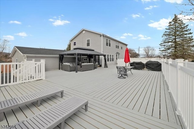 wooden deck featuring an outdoor hangout area and a gazebo