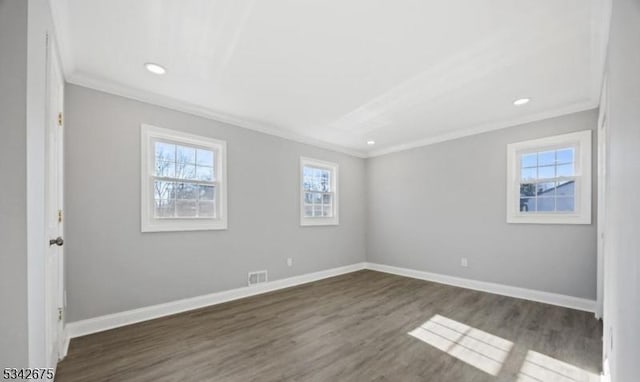 unfurnished bedroom with crown molding, baseboards, and visible vents