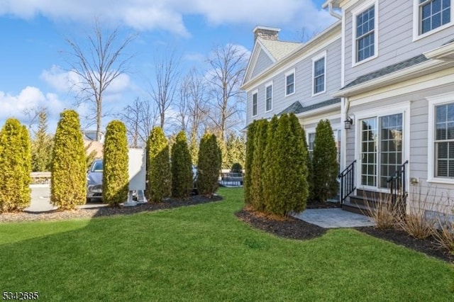 view of yard featuring entry steps