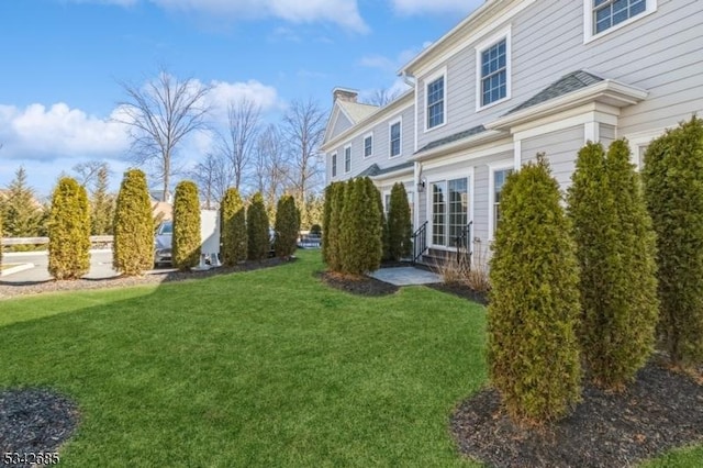 view of yard with entry steps