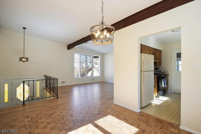 spare room featuring lofted ceiling with beams, a notable chandelier, and baseboards