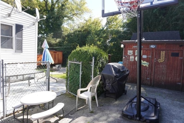 view of patio with fence and area for grilling